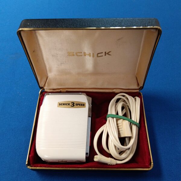 Vintage Schick 3 speed electric razor in its original case.