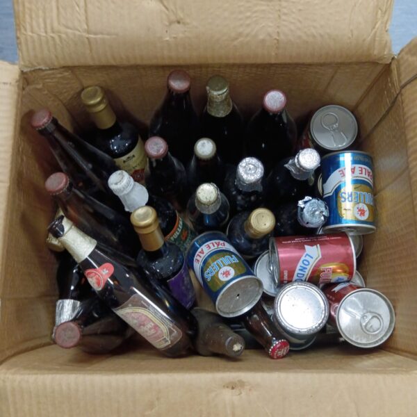 Vintage beer bottles collection, full and empty, for collectors.