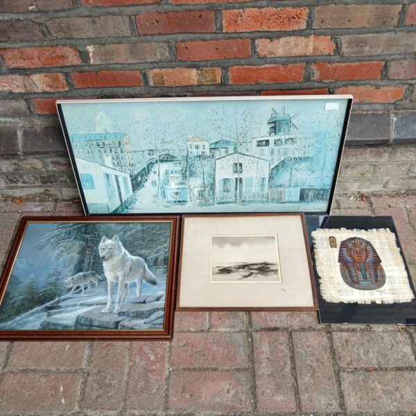 Collection of framed art prints and Egyptian papyrus painting.