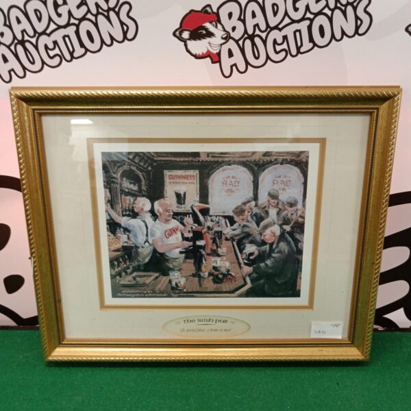 Framed Irish pub print featuring a lively pub scene with Guinness.