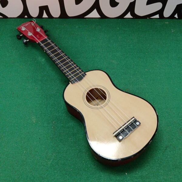 Light-coloured Martin Smith UK-212-A soprano ukulele, front view.