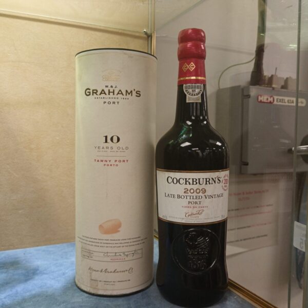 Graham's and Cockburn's port wine bottles in a collection.
