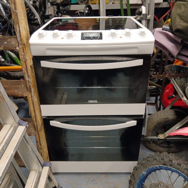 White Zanussi electric cooker with induction hob and oven.