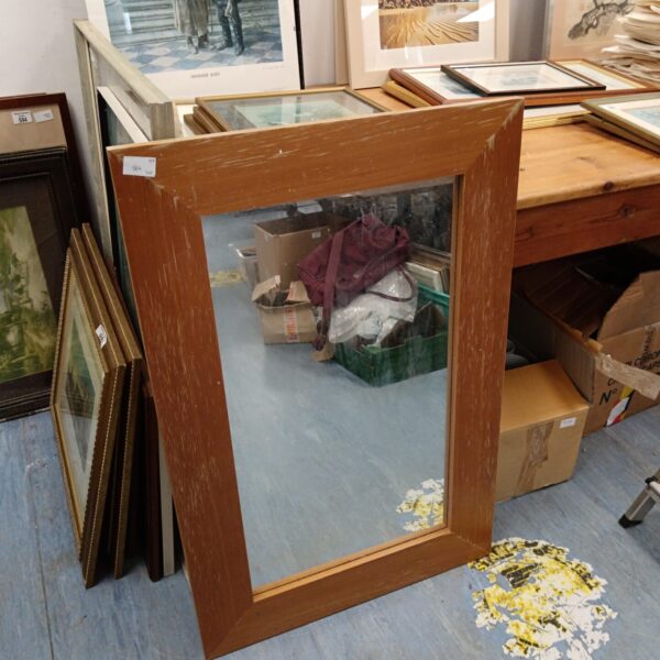 Rectangular wood framed mirror for home decor.