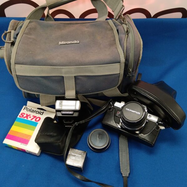 Vintage Olympus OM-10 film camera with carrying case.