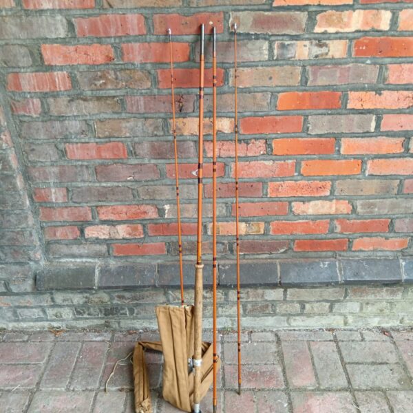 Vintage Aberdeen Scottie split cane fishing rod with bag.