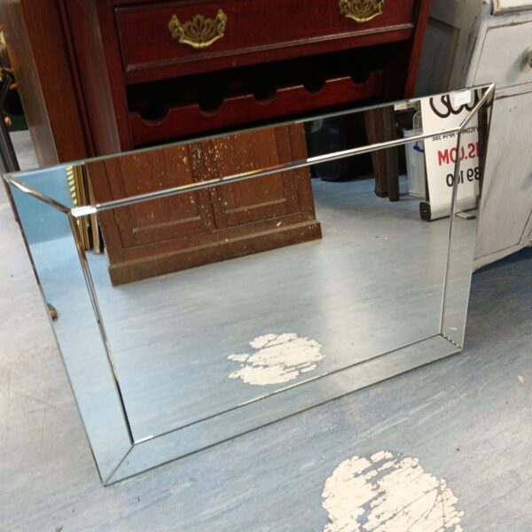 Rectangular mirror with mirrored edge, modern home decor.