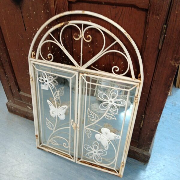 Vintage butterfly garden window mirror with metal frame.