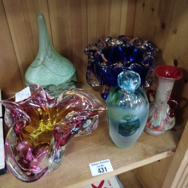 Colourful selection of art glass vases and bowls for collectors.