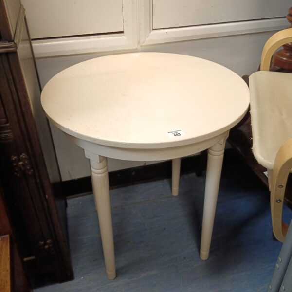 Small round shabby chic side table with turned legs.