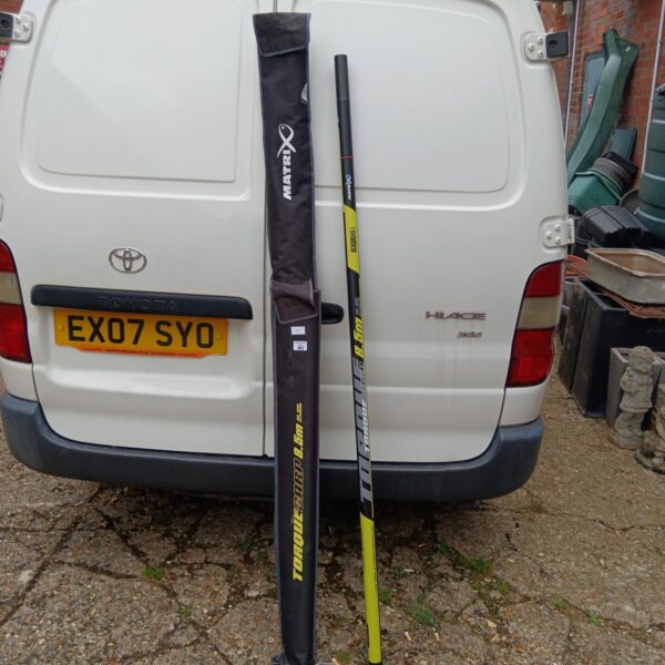 Matrix Torque Carp 8.5m fishing pole leaning against a van.