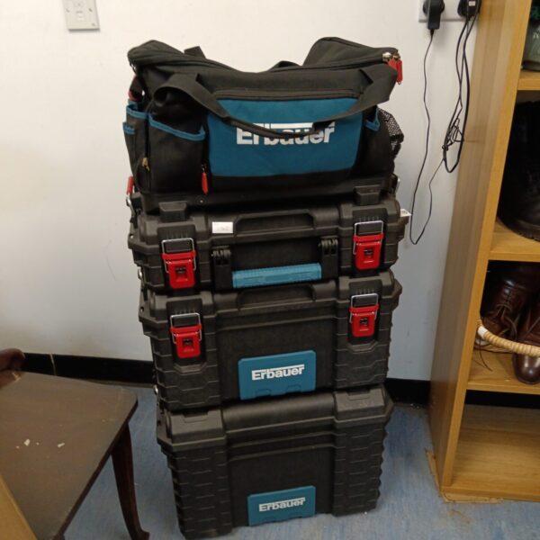 Stacked Erbauer tool boxes and carry bag for workshop storage.