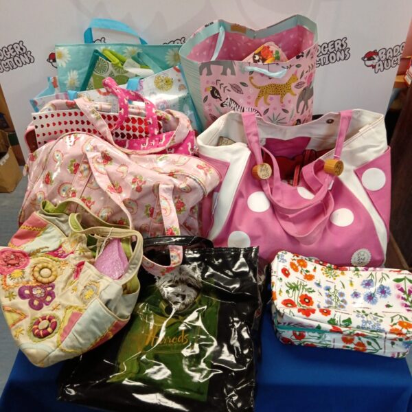 Colourful ladies handbags presented as a mixed lot.