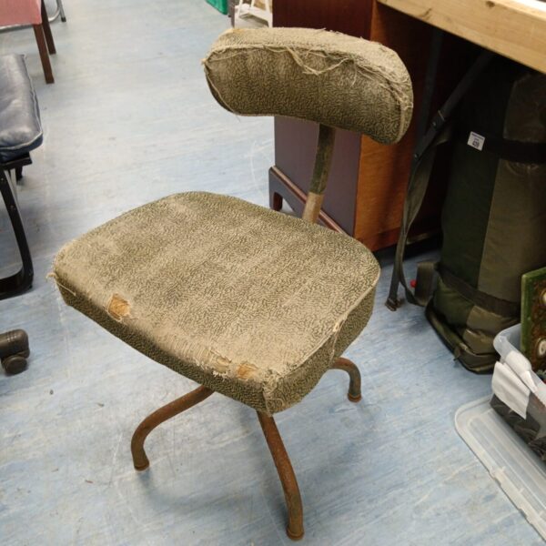 Vintage Victor Tansad machinist chair with textured upholstery.