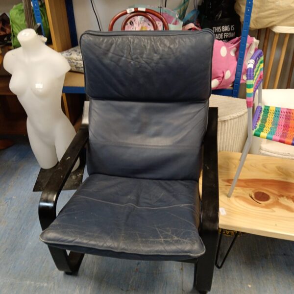 Vintage blue leather chair with black metal frame.