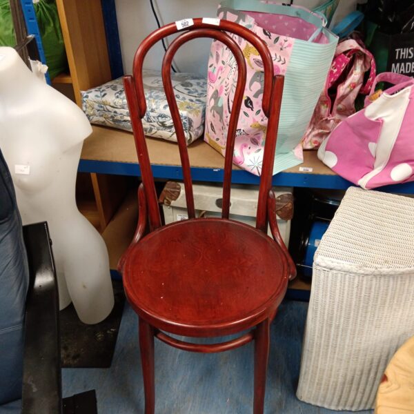 Vintage bentwood dining chair with three spindles.