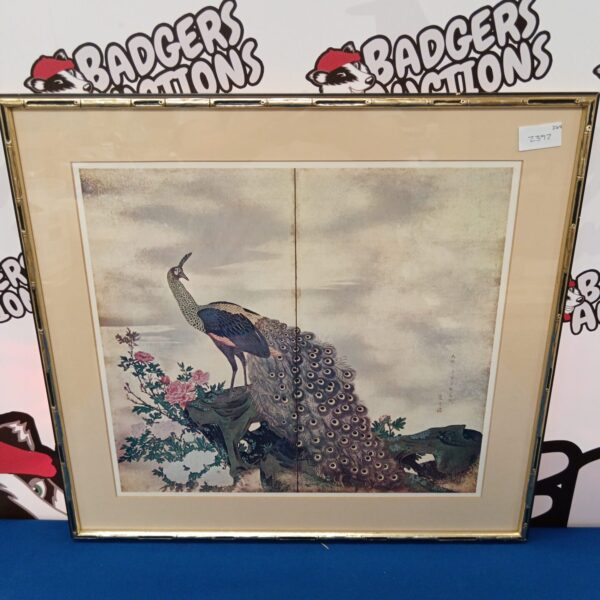 Vintage Japanese print of a colourful peacock in a frame.