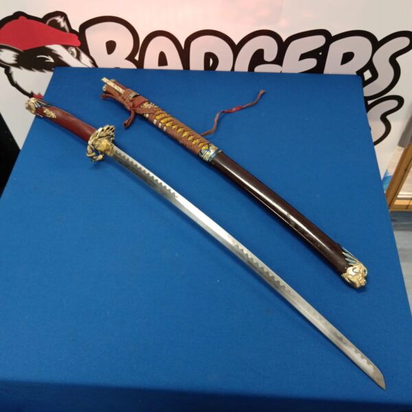Detailed dragon samurai sword with intricate handle and blade.