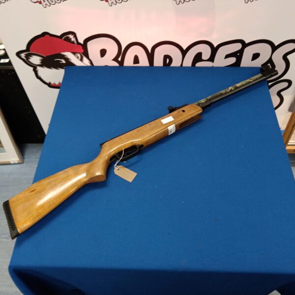Vintage SMK XS36-1 .22 calibre lever action air rifle on blue background.