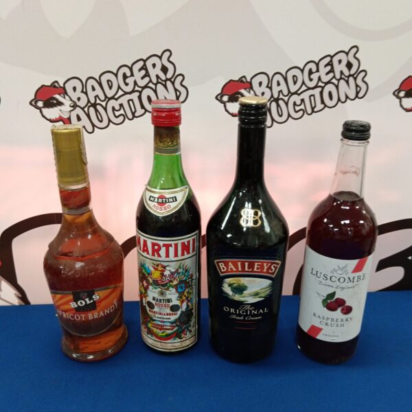 Vintage alcohol bottles including Martini and Bols apricot brandy.