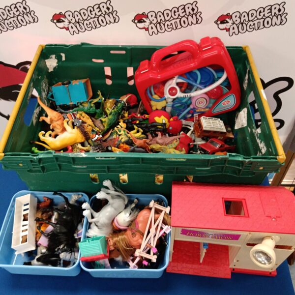 Toy horses and dinosaurs lot with a small plastic stable.