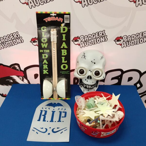 Collection of glow in the dark toys including Diablo branded item.