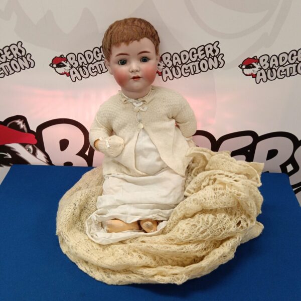 Vintage bisque porcelain doll marked 55 with lace dress.
