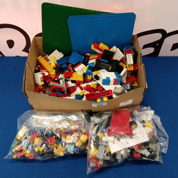Vintage Lego bricks lot in a cardboard box.