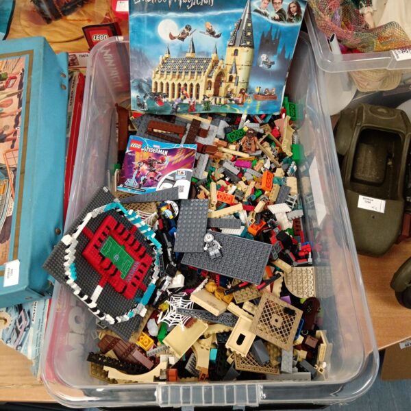 Tray of mixed Lego and building bricks for construction play.