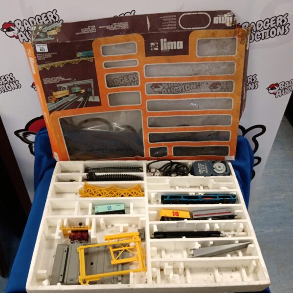 Vintage Lima HO scale train set parts in a plastic case.