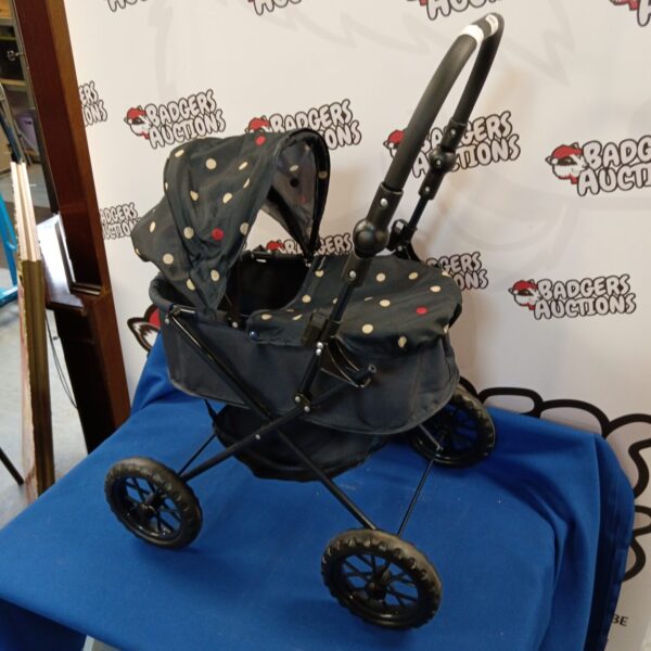 Vintage Mama & Papas doll pram with polka dots.