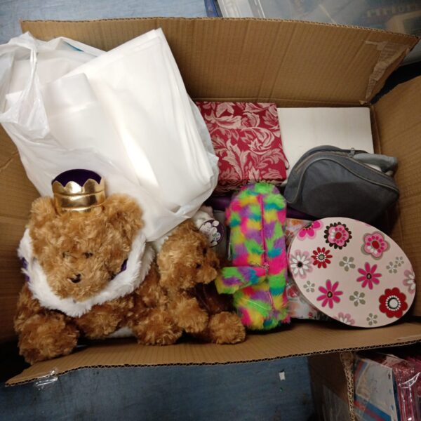 Mixed lot of teddy bears and colourful gift boxes.