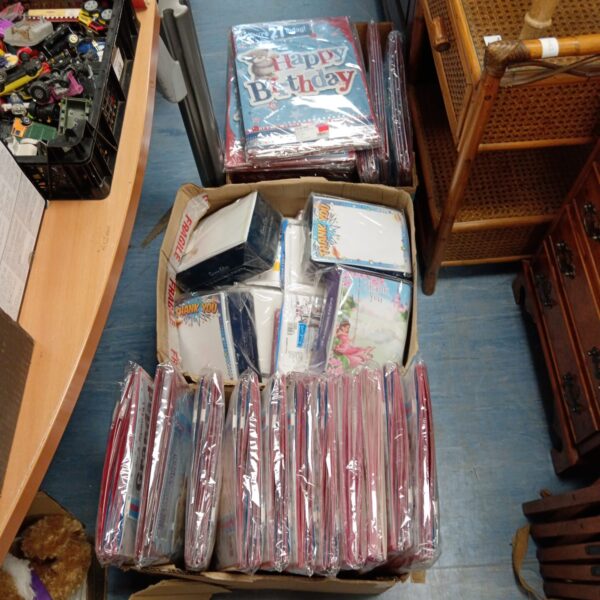Three boxes of new, unused birthday cards and celebration cards.