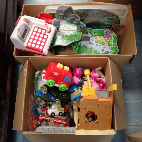 Colourful children's toy lot with a cash register and vehicles.