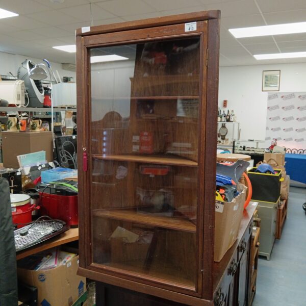 Vintage wooden corner display cabinet with glass front.