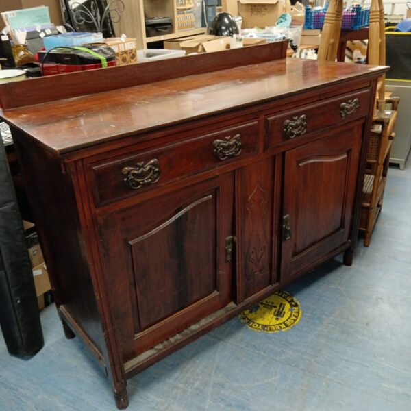 Front view of a Victorian oak sideboard needing restoration.
