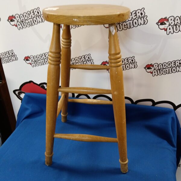 Vintage light oak stool with curved legs.