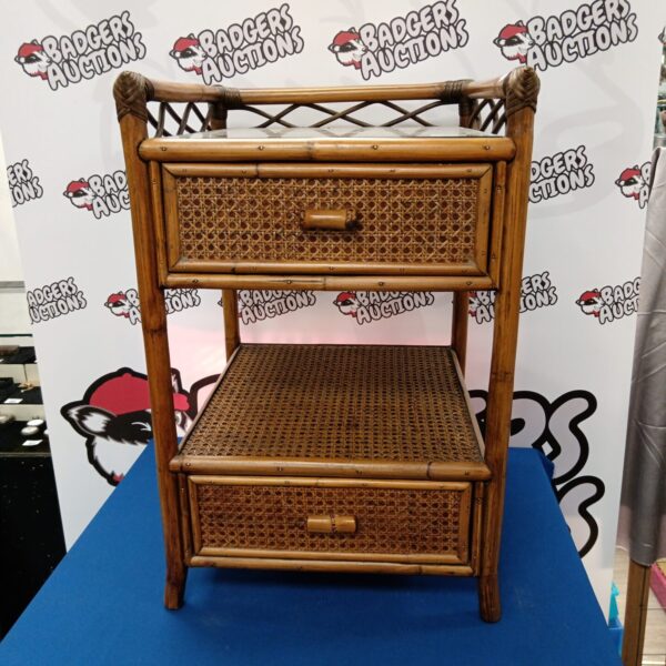 Vintage bamboo bedside cabinet with glass top and rattan drawer.
