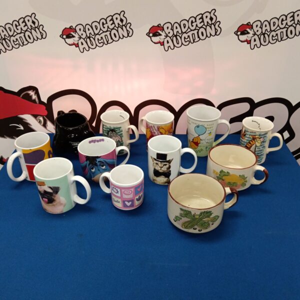 Collection of Disney and Star Wars character mugs for collectors.