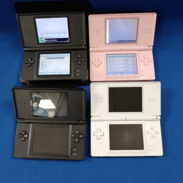 Group of four Nintendo DS Lite consoles for retro gaming collectors.