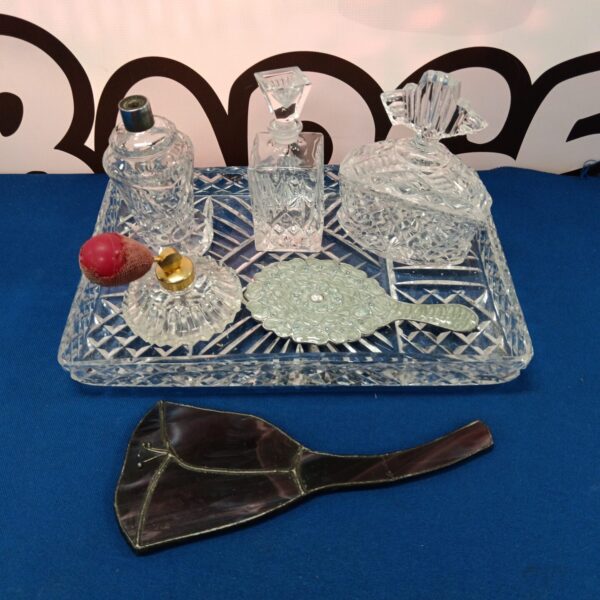 Vintage crystal dressing table set with atomiser and perfume bottles.