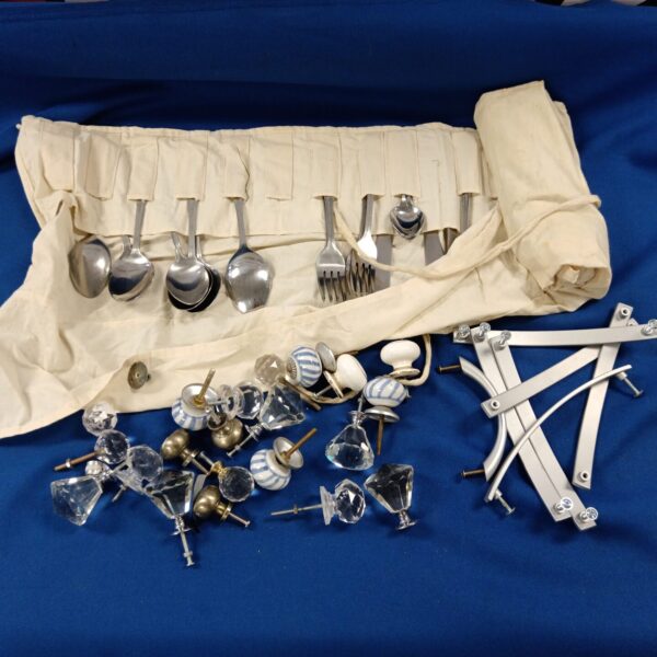Vintage cupboard knobs and silver plated cutlery in a mixed lot.