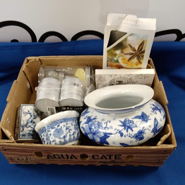 Tray of blue and white china pots and candle holders.