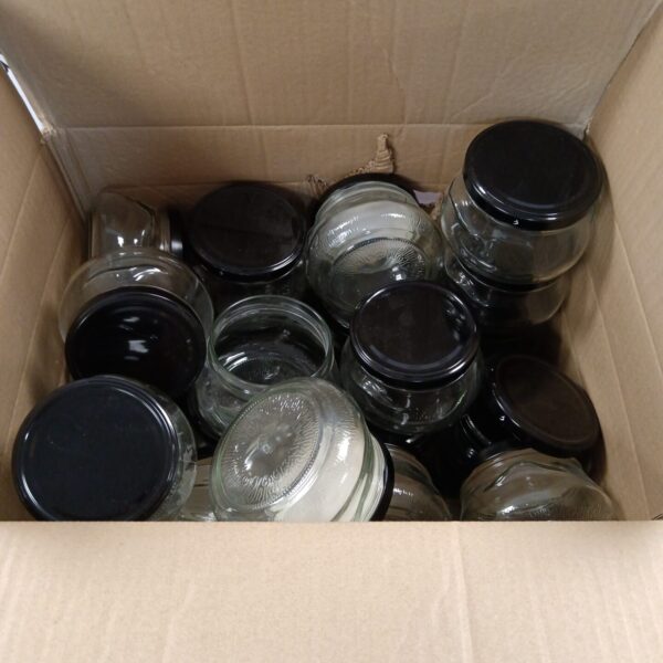 Box of thirty glass preserve jars for canning and storage.