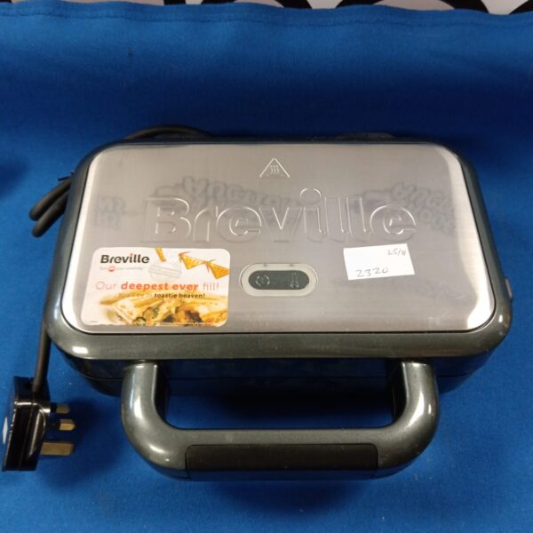 Black Breville sandwich maker for toasted sandwiches and paninis.