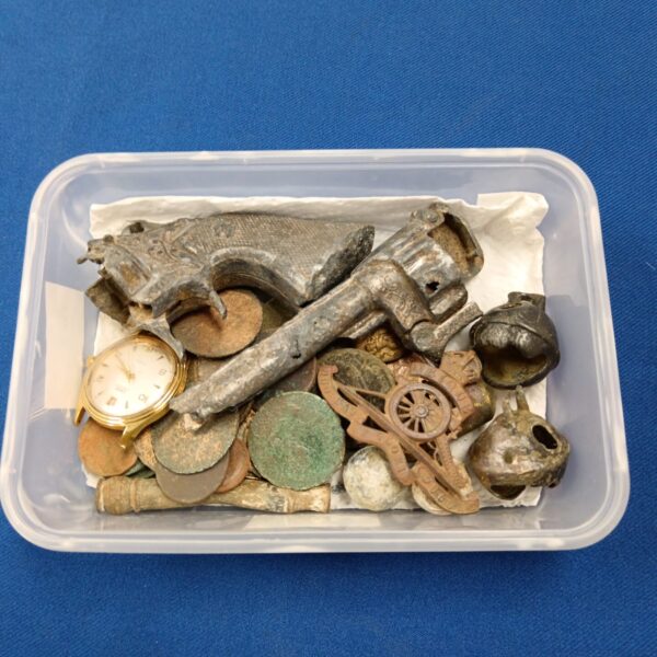 Tray of metal detector finds and antique curios for collectors.