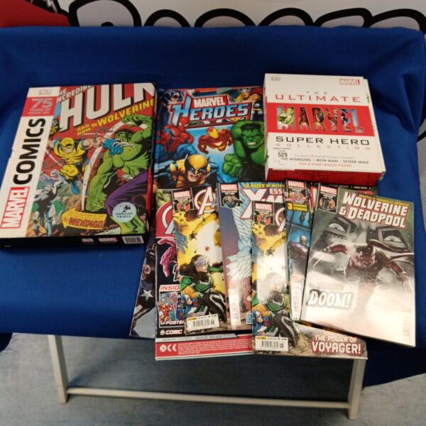 Marvel Comics collection featuring Wolverine and Deadpool cover art.