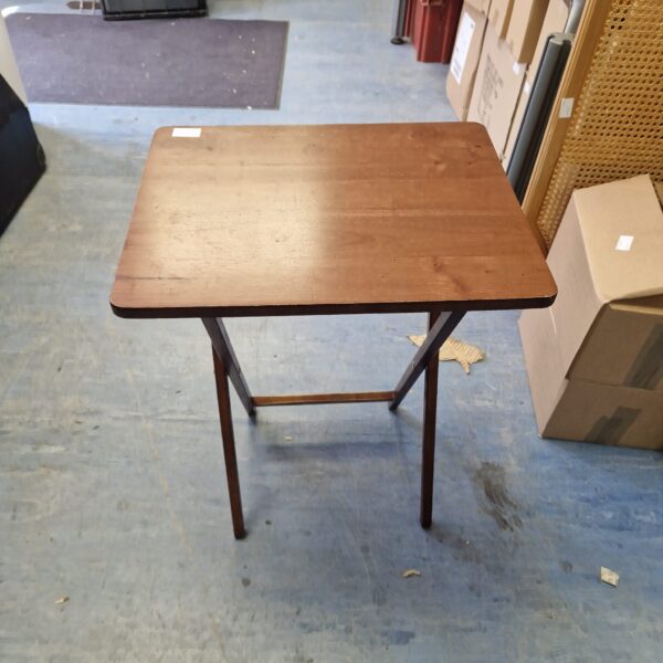 Vintage wooden folding table with a warm wood tone.