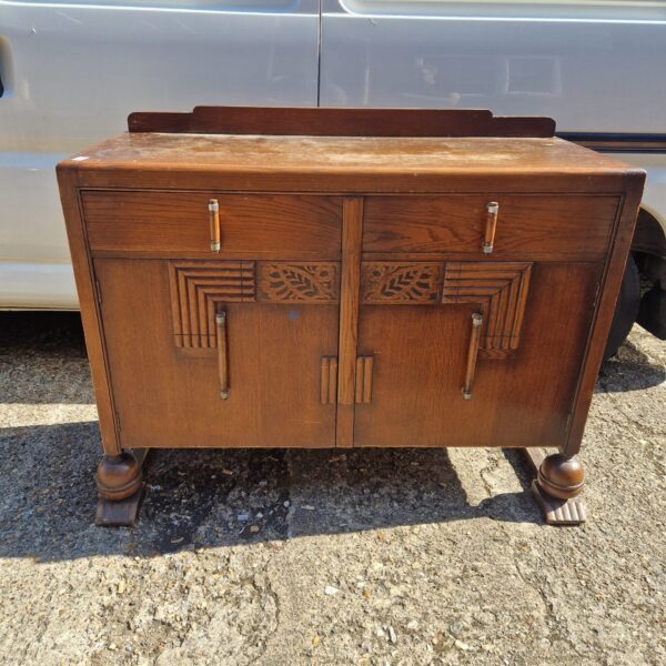 Vintage 1950s wood sideboard with drawers and cabinet space.