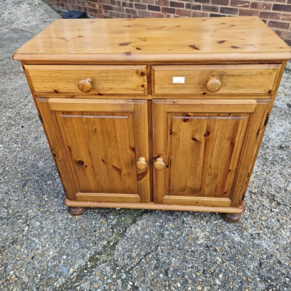 Antique pine sideboard with a single drawer and cupboard.